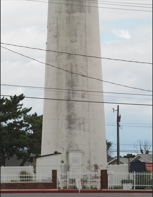 lighthouse with distracting wires and a pole